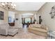 Inviting living area with tile floors, and a seamless transition to the dining space at 11343 Dancing River Dr, Venice, FL 34292