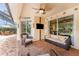 Outdoor screened patio with seating and entertainment options at 11343 Dancing River Dr, Venice, FL 34292