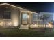 Charming home exterior with beautiful glass front door and manicured landscaping at 1144 Rushmore Dr, Holiday, FL 34690