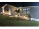Well-maintained front yard with exterior lighting and a freshly painted home at 1144 Rushmore Dr, Holiday, FL 34690