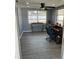 Room with desk, chair, and natural light streaming through the windows at 1144 Rushmore Dr, Holiday, FL 34690