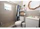 Updated bathroom features a tiled shower, modern vanity, and decorative mirror at 11907 Frontage Rd, Dade City, FL 33525