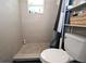 The bathroom features a stand up shower with a shower curtain at 11907 Frontage Rd, Dade City, FL 33525