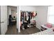 Bright bedroom features a closet with ample storage and access to an adjacent room at 11907 Frontage Rd, Dade City, FL 33525