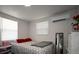 Bright bedroom featuring decor, a bed, and natural light at 11907 Frontage Rd, Dade City, FL 33525