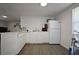 Bright kitchen featuring modern cabinetry and appliances at 11907 Frontage Rd, Dade City, FL 33525