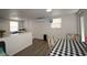 Open living area with modern fixtures and a door that leads outside at 11907 Frontage Rd, Dade City, FL 33525