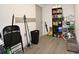 Spacious utility room with shelving, storage, and access to an exterior door at 11907 Frontage Rd, Dade City, FL 33525