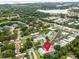 Community aerial view highlighting well-maintained landscaping and nearby lake at 1250 S Pinellas Ave # 207, Tarpon Springs, FL 34689