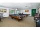 Recreation room featuring two billiards tables, overhead lighting, and comfortable seating at 1250 S Pinellas Ave # 207, Tarpon Springs, FL 34689