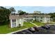 Well-maintained condo building featuring a lush lawn, parking and a nice entrance at 1250 S Pinellas Ave # 207, Tarpon Springs, FL 34689