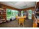 Quiet library with bookshelves, a round table with chairs, and window views at 1250 S Pinellas Ave # 207, Tarpon Springs, FL 34689