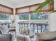 Bright living room featuring comfortable seating and large windows with neighborhood views at 1250 S Pinellas Ave # 207, Tarpon Springs, FL 34689