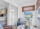 Cozy sitting area with sliding glass door, comfortable seating, and bright natural light at 1250 S Pinellas Ave # 207, Tarpon Springs, FL 34689