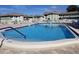 Sparkling community pool perfect for swimming and relaxation on a sunny day at 1250 S Pinellas Ave # 207, Tarpon Springs, FL 34689