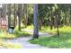 A peaceful walking trail surrounded by trees and lush greenery at 1250 S Pinellas Ave # 207, Tarpon Springs, FL 34689