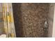 Bathroom shower with decorative tile walls at 12760 Indian Rocks Rd # 1049, Largo, FL 33774