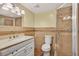 Bathroom featuring tile shower, updated vanity, and tile floors at 12760 Indian Rocks Rd # 1049, Largo, FL 33774