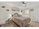Bright bedroom featuring wood floors and beach-themed decor at 12760 Indian Rocks Rd # 1049, Largo, FL 33774