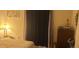 Cozy bedroom with a large window, dresser, and soft lighting at 12760 Indian Rocks Rd # 1049, Largo, FL 33774