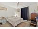 Calm bedroom featuring carpet, a ceiling fan, and plenty of natural light at 12760 Indian Rocks Rd # 1049, Largo, FL 33774