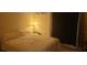 Bedroom featuring soft lighting and a view of the window and curtains at 12760 Indian Rocks Rd # 1049, Largo, FL 33774