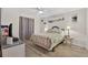 Comfortable bedroom with wood floors and a decorative ceiling fan at 12760 Indian Rocks Rd # 1049, Largo, FL 33774