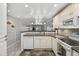 Bright and open kitchen looking into the living room, equipped with modern appliances at 12760 Indian Rocks Rd # 1049, Largo, FL 33774