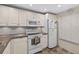 Bright kitchen showcasing white cabinets, modern appliances, and plenty of counter space at 12760 Indian Rocks Rd # 1049, Largo, FL 33774