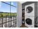 A stackable washer and dryer in the laundry room of the unit at 12760 Indian Rocks Rd # 1049, Largo, FL 33774