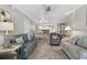 Inviting living room with tile floors, neutral paint, ceiling fan, and plenty of seating at 12760 Indian Rocks Rd # 1049, Largo, FL 33774