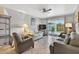 Bright living room with tile floors, ceiling fan, and sliding doors to the outside patio at 12760 Indian Rocks Rd # 1049, Largo, FL 33774