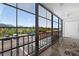 A screened patio with a view of trees and parking at 12760 Indian Rocks Rd # 1049, Largo, FL 33774