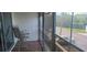 Enclosed porch with seating and views of the surrounding neighborhood at 12760 Indian Rocks Rd # 1049, Largo, FL 33774