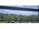 View of the community and surrounding trees from the unit's window at 12760 Indian Rocks Rd # 1049, Largo, FL 33774