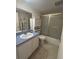 Functional bathroom with a sink, vanity, toilet, and enclosed shower at 12760 Indian Rocks Rd # 904, Largo, FL 33774
