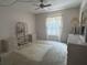 Comfortable bedroom with a ceiling fan, generous natural light, and neutral color palette at 12760 Indian Rocks Rd # 904, Largo, FL 33774