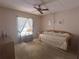 Bright bedroom with a ceiling fan, natural light, and a cozy daybed for relaxation at 12760 Indian Rocks Rd # 904, Largo, FL 33774