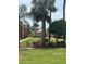 Manicured community area with lush greenery, featuring picnic area with shade and outdoor cooking facilities at 12760 Indian Rocks Rd # 904, Largo, FL 33774