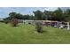 Community kayak storage with neat racks and lush landscaping, ideal for residents to explore waterways at 12760 Indian Rocks Rd # 904, Largo, FL 33774