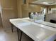 Folding area in the community laundry room, featuring a large mirror and a convenient folding space at 12760 Indian Rocks Rd # 904, Largo, FL 33774