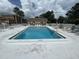 Inviting community swimming pool with lounge chairs for relaxing poolside at 12760 Indian Rocks Rd # 904, Largo, FL 33774