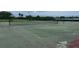 Outdoor tennis court on the property with a well-maintained net and lines ready for a match at 12760 Indian Rocks Rd # 904, Largo, FL 33774