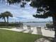 Waterfront seating area with lounge chairs and serene water views at 12760 Indian Rocks Rd # 904, Largo, FL 33774