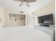 Bright bedroom featuring a spacious closet and contemporary furniture at 13684 Orange Sunset Dr # 101, Tampa, FL 33618