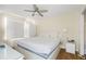 Comfortable bedroom with a large bed, neutral decor, and a ceiling fan at 13684 Orange Sunset Dr # 101, Tampa, FL 33618