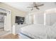 Bedroom with a television, ample closet space, and a view of the kitchen at 13684 Orange Sunset Dr # 101, Tampa, FL 33618