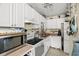Functional kitchen with white cabinetry, essential appliances, and efficient layout at 13684 Orange Sunset Dr # 101, Tampa, FL 33618