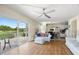 Bright open-concept living space with wood floors and sliding glass doors leading to a patio at 13684 Orange Sunset Dr # 101, Tampa, FL 33618