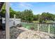 Paver patio with a white fence overlooking the scenic pond at 13684 Orange Sunset Dr # 101, Tampa, FL 33618